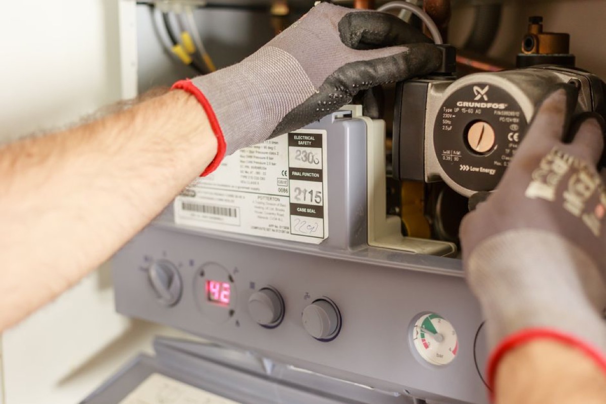 Commercial-grade condensing gas tankless water heater installation, heavy-duty residential and light commercial use